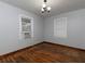 Cozy bedroom featuring hardwood floors and natural light at 3844 Oglesby Rd, Powder Springs, GA 30127
