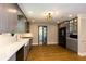 Spacious updated kitchen features gray cabinets, stainless appliances, and breakfast area at 5369 Blue Grass Ln, Sugar Hill, GA 30518