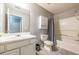 Bathroom featuring a combined shower-tub, vanity, toilet, and practical gray flooring at 7617 Lakemoor Dr, Riverdale, GA 30296
