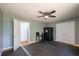Bedroom featuring a ceiling fan, dual closets, a sauna, and black floors at 7617 Lakemoor Dr, Riverdale, GA 30296