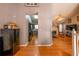 Hallway view leading to the kitchen and living area, showcasing hardwood flooring at 7617 Lakemoor Dr, Riverdale, GA 30296