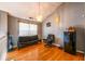 Upstairs living area with hardwood floors, a chandelier, and a relaxing seating area at 7617 Lakemoor Dr, Riverdale, GA 30296