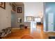 Upstairs living area with hardwood floors, natural light, and a comfortable seating area at 7617 Lakemoor Dr, Riverdale, GA 30296
