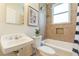 Bathroom features classic fixtures, tile surround, tub with shower and a window for natural light at 1015 Piedmont Ne Ave # A2, Atlanta, GA 30309