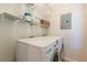 Bright laundry room features modern LG washer and dryer with wire shelving for storage at 1015 Piedmont Ne Ave # A2, Atlanta, GA 30309