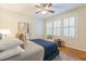 Bedroom features hardwood floors, plantation shutters, neutral paint and a comfortable blue bed at 1015 Piedmont Ne Ave # A2, Atlanta, GA 30309