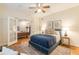 Bedroom with hardwood floors, neutral paint, and double doors that lead to the living area at 1015 Piedmont Ne Ave # A2, Atlanta, GA 30309