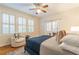 Bedroom features hardwood floors, plantation shutters, neutral paint and a comfortable blue bed at 1015 Piedmont Ne Ave # A2, Atlanta, GA 30309
