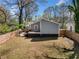 Spacious, fenced backyard provides privacy and outdoor enjoyment, complemented by a charming deck area at 1947 Maywood Nw Pl, Atlanta, GA 30318