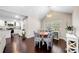 Open concept living space with kitchen featuring stainless steel appliances, granite countertops and a dining area with natural light at 1947 Maywood Nw Pl, Atlanta, GA 30318
