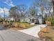 Street view of homes with a well-manicured lawn and driveways at 1947 Maywood Nw Pl, Atlanta, GA 30318