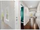 Hallway with wood floors that leads to porch and other rooms in the house at 1947 Maywood Nw Pl, Atlanta, GA 30318