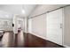 Hallway features hardwood floors and sliding barn doors leading to bedrooms and living area at 1947 Maywood Nw Pl, Atlanta, GA 30318