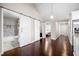 Hallway features hardwood floors and sliding barn doors leading to a bathroom and a bedroom at 1947 Maywood Nw Pl, Atlanta, GA 30318