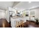 Modern kitchen featuring white cabinetry, granite countertops, and stainless steel appliances at 1947 Maywood Nw Pl, Atlanta, GA 30318