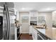 Bright kitchen with stainless steel appliances, granite countertops, and ample natural light, providing a welcoming atmosphere at 1947 Maywood Nw Pl, Atlanta, GA 30318