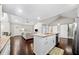 Open concept kitchen with granite countertops, white cabinets, stainless steel appliances, and seamless flow into the living area at 1947 Maywood Nw Pl, Atlanta, GA 30318
