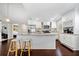 Bright kitchen with stainless steel appliances, granite counters, and white cabinetry, offering a modern and stylish cooking space at 1947 Maywood Nw Pl, Atlanta, GA 30318