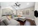 Open concept living room with large sofa and hardwood floors at 1947 Maywood Nw Pl, Atlanta, GA 30318