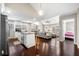 Open concept living space with kitchen featuring stainless steel appliances, granite countertops and a dining area with natural light at 1947 Maywood Nw Pl, Atlanta, GA 30318