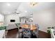 Open concept living area with hardwood floors, vaulted ceiling, dining area and modern kitchen with stainless steel appliances at 1947 Maywood Nw Pl, Atlanta, GA 30318