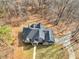 Beautiful aerial view of a home with a long driveway surrounded by trees at 355 Parker Rd, Covington, GA 30014