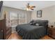 Comfortable bedroom featuring dark wood furnishings, a large window, and soft lighting for a restful ambiance at 355 Parker Rd, Covington, GA 30014