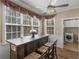 Bright breakfast nook with large windows, chandelier, and access to the laundry room at 355 Parker Rd, Covington, GA 30014
