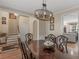 Traditional dining room with a dark wood table and chairs set below a decorative chandelier, perfect for gatherings at 355 Parker Rd, Covington, GA 30014