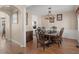 An inviting dining room featuring a classic chandelier and access to other rooms at 355 Parker Rd, Covington, GA 30014