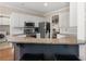 Kitchen with stainless steel appliances, granite countertops, white cabinets, and breakfast bar at 355 Parker Rd, Covington, GA 30014