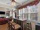Open-concept breakfast nook with chandelier and rustic wooden bar at 355 Parker Rd, Covington, GA 30014