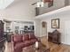 Cozy living room with hardwood floors and open view to kitchen, showcasing a comfortable and inviting space at 355 Parker Rd, Covington, GA 30014