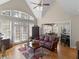 Spacious living room featuring vaulted ceilings, a fireplace, and breakfast nook at 355 Parker Rd, Covington, GA 30014