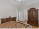 Spacious main bedroom showcasing dark wooden furniture and a serene atmosphere with ample natural light at 355 Parker Rd, Covington, GA 30014