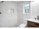 Modern bathroom features a large marble-tiled shower, stylish vanity, and herringbone tile floor at 3569 Vinyard Way, Lawrenceville, GA 30044