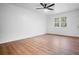 Bright, freshly painted bedroom with light laminate floors, and ceiling fan at 3569 Vinyard Way, Lawrenceville, GA 30044