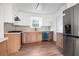 Updated kitchen featuring stainless steel appliances, sleek countertops, and stylish two-tone cabinetry at 3569 Vinyard Way, Lawrenceville, GA 30044
