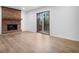 Relaxing living room with a brick fireplace and sliding glass doors leading to the backyard at 3569 Vinyard Way, Lawrenceville, GA 30044