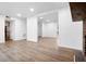 Open-concept living space features sleek flooring, updated lighting, and views into other rooms at 3569 Vinyard Way, Lawrenceville, GA 30044