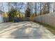 Expansive backyard concrete area perfect for outdoor activities and entertaining, surrounded by a wood fence at 405 Rabbits Run, Fayetteville, GA 30214