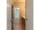 Neutral bathroom featuring tile floors, wooden cabinets, and a view of the bathtub at 405 Rabbits Run, Fayetteville, GA 30214