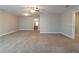 Large bedroom boasts neutral walls, carpet, and ceiling fan at 405 Rabbits Run, Fayetteville, GA 30214