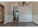 Dining area with hardwood floors, wainscoting, and chandelier lighting at 405 Rabbits Run, Fayetteville, GA 30214