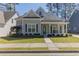 Charming one-story home featuring a welcoming front porch and well-maintained lawn at 405 Rabbits Run, Fayetteville, GA 30214