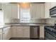 Well-equipped kitchen with granite countertops, subway tile backsplash and stainless steel appliances at 405 Rabbits Run, Fayetteville, GA 30214