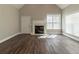 Bright living room with hardwood floors, fireplace, and natural light at 405 Rabbits Run, Fayetteville, GA 30214