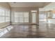 Open-concept living area with large windows and hardwood floors at 405 Rabbits Run, Fayetteville, GA 30214