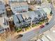 Aerial view of townhomes surrounded by mature trees and greenery shows community setting at 540 Ridge View Xing, Woodstock, GA 30188