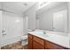 This bathroom offers a shower and tub combo, a toilet, and a sink with wood cabinets at 540 Ridge View Xing, Woodstock, GA 30188